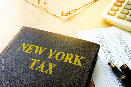 Canvas Print Book with title New York tax and calculator.