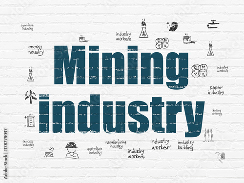 Manufacuring concept  Painted blue text Mining Industry on White Brick wall background with  Hand Drawn Industry Icons