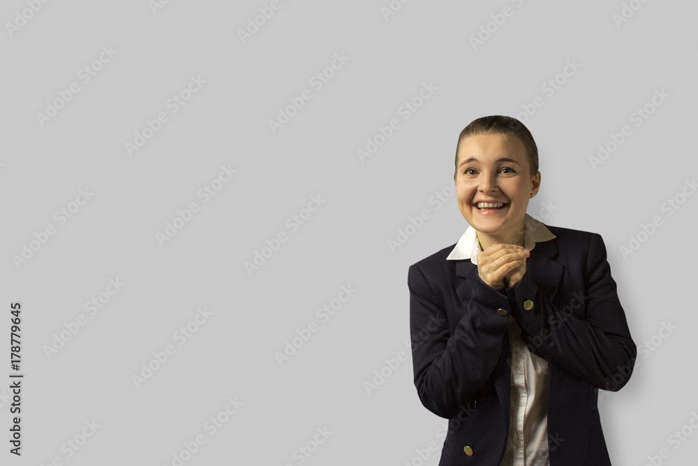 portrait shot. young beautiful business woman with short hair combed back, wearing a jacket.