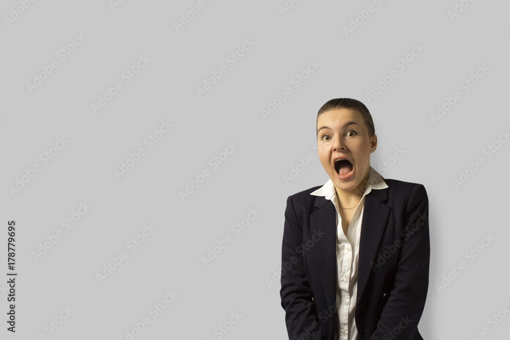 portrait shot. young beautiful business woman with short hair combed back, wearing a jacket. portrait shot. young beautiful business woman with short hair combed back, wearing a jacket.