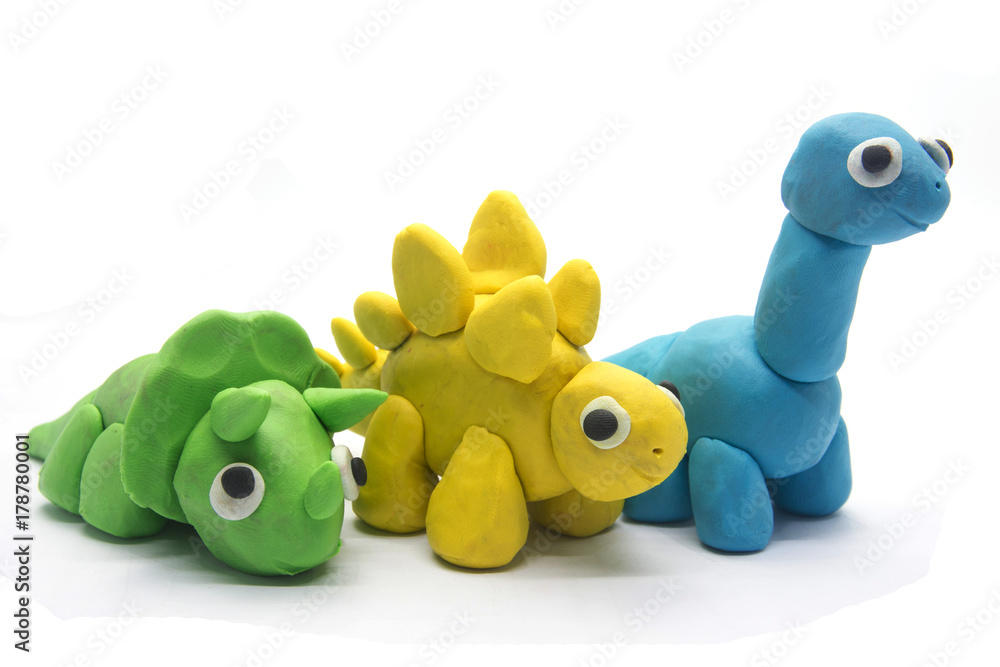 Obraz premium Bawić się ciasto dinosaura na białym tle