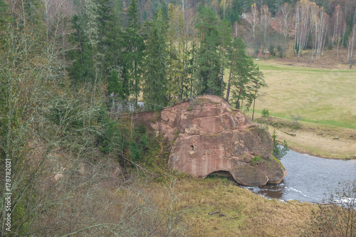 River Amta, autumn, red rocks, wood, Latvia. 2017 photo