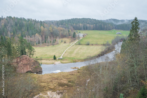 River Amta, autumn, red rocks, wood, Latvia. 2017 photo