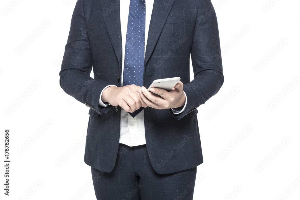 business man standing up with smart phone isolated white. business man standing up with smart phone isolated white.