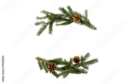 Christmas flat lay composition of fir branches and pine cones with copy space for text. top view