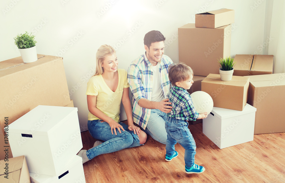 happy family moving to new home and playing ball happy family moving to new home and playing ball