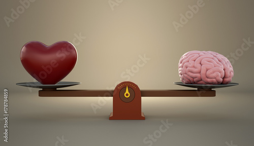 Brain and heart on a wooden balance scale.