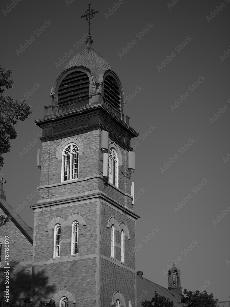 Black and white photo of a church steeple