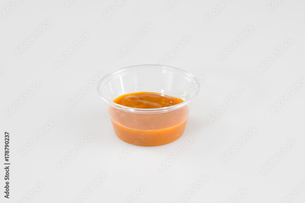 plastic cup sauce Relish mustard ketchup and mayonnaise condiments in clear containers on white background plastic cup sauce Relish mustard ketchup and mayonnaise condiments in clear containers on white background