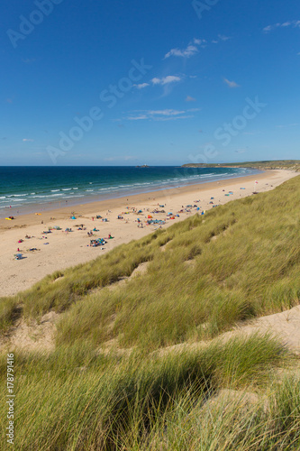 St Ives Bay beach Cornwall uk in summer with people blue sky and sea  view towards Godrevy lighthouse