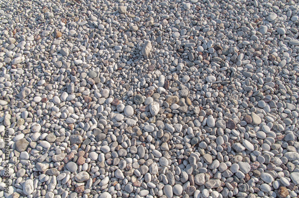 Big texture of small pebble stone nature at beach on sunny day Big texture of small pebble stone nature at beach on sunny day