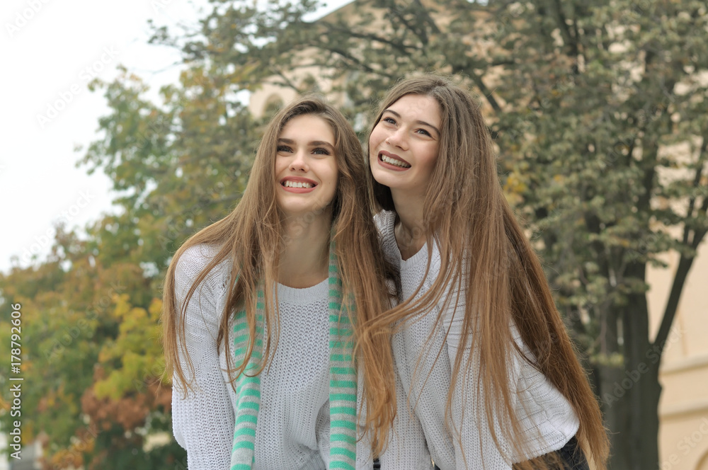 Portrait of two girls who have fun laughing Portrait of two girls who have fun laughing