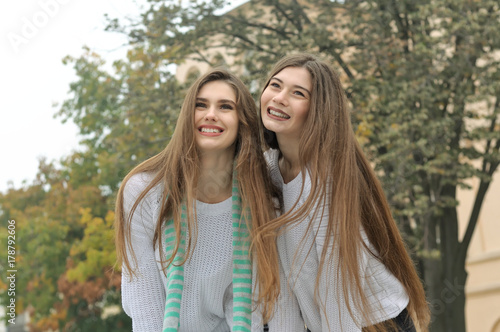 Portrait of two girls who have fun laughing