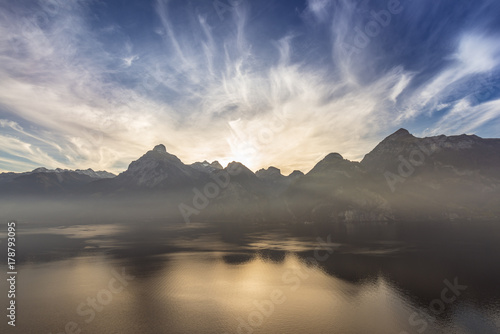Shades of a half tone of blue. Panorama of the mountain landscape. Clouds over the peaks. Lake Lucerne. Swiss Alps.