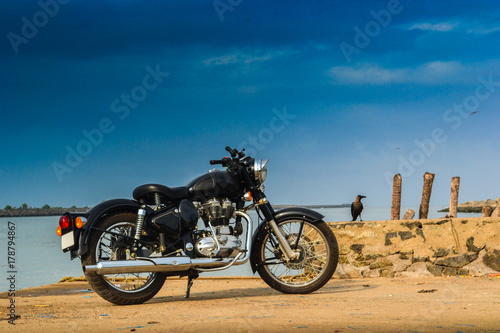 Vintage bike parked near sea