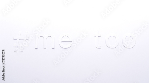 paper letters of #metoo on a white cardboard