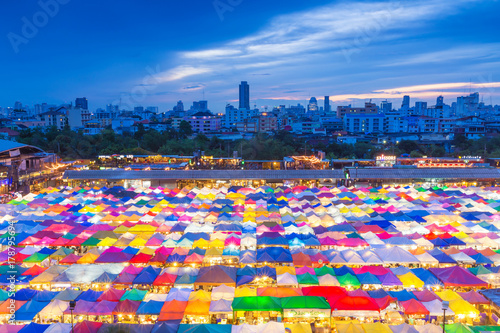 BANGKOK - Thailand  August 08  2017   Talad Rod Fai or Train Market. Mmulti-colored tents with beautiful sky after sunset over night market. The place of second-hand market in Bangkok  Thailand.