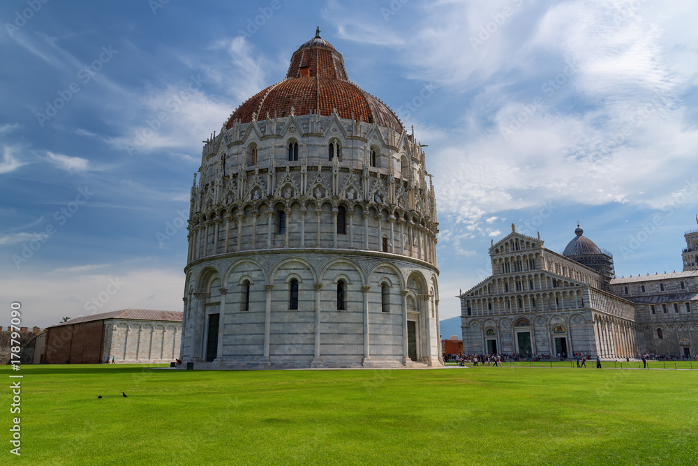 Stunning daily view at the Pisa Baptistery, the Pisa Cathedral and the Tower of Pisa. They are located in the Piazza dei Miracoli (Square of Miracles) in Pisa, Italy.