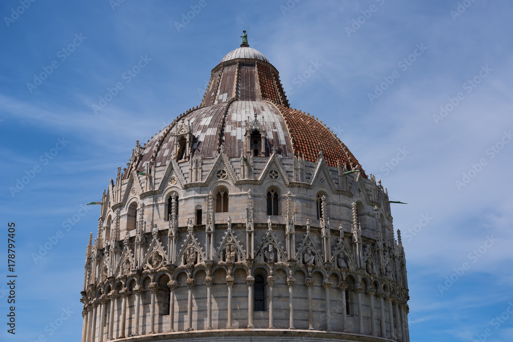 Details of the exterior of the Pisa Baptistery of St. John, the largest baptistery in Italy, in the Square of Miracles (Piazza dei Miracoli), Pisa, Italy.