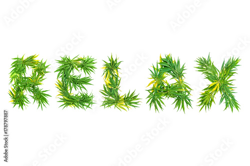 Word RELAX made from green cannabis leaves on a white background. Isolated