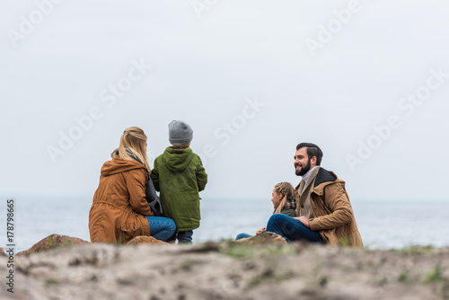 family spending time on seashore