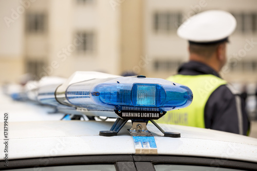 Police officers cars warning lightbars