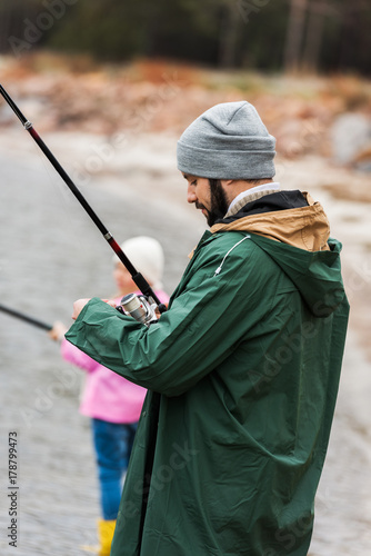 father and daughter fishing together