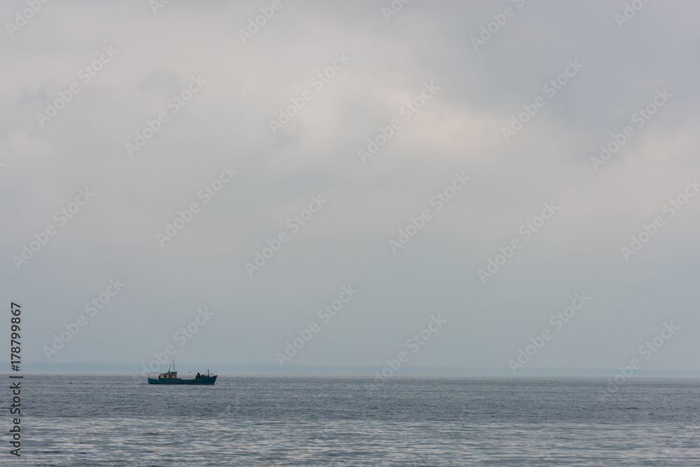 lonely ship floating in sea