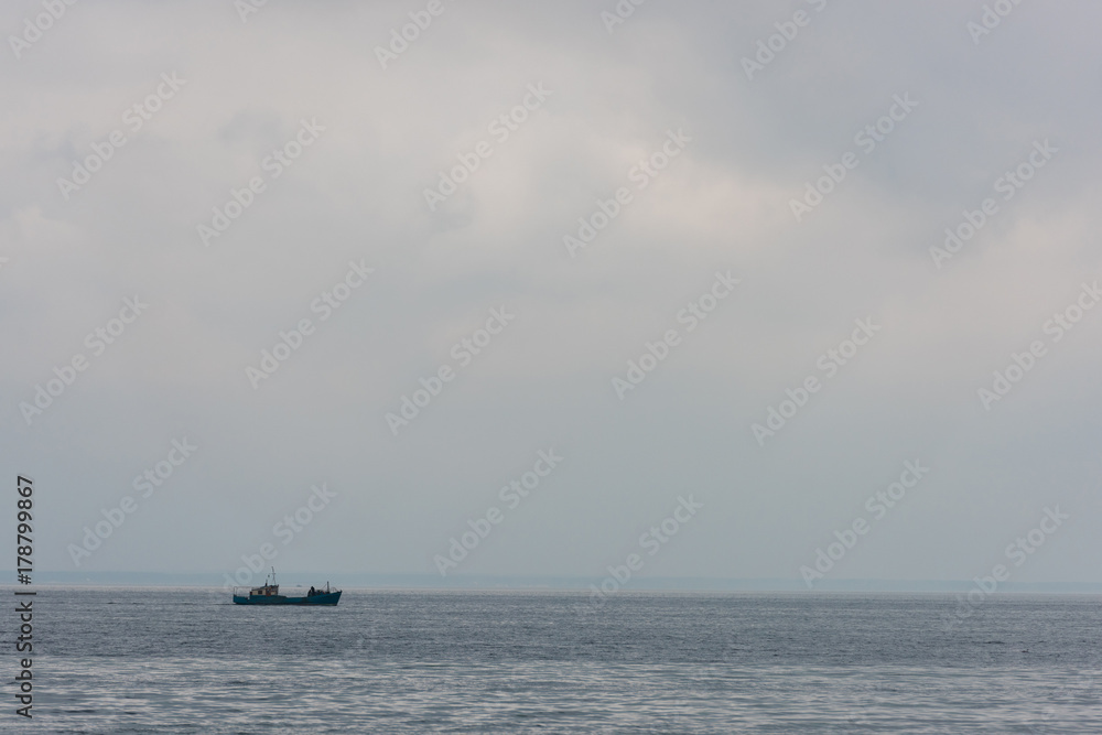 lonely ship floating in sea lonely ship floating in sea