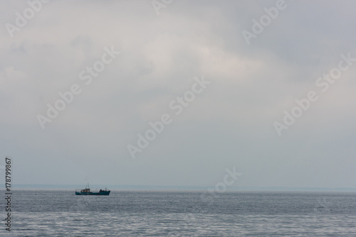 lonely ship floating in sea