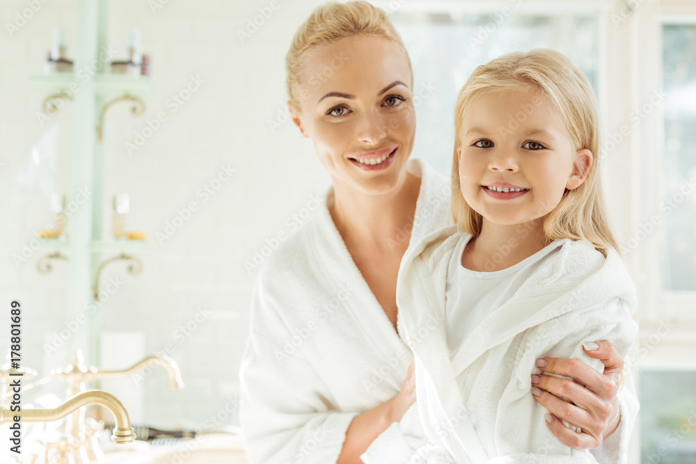 mother and daughter in bathrobes mother and daughter in bathrobes