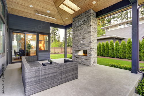 Tela New modern home features a backyard with patio
