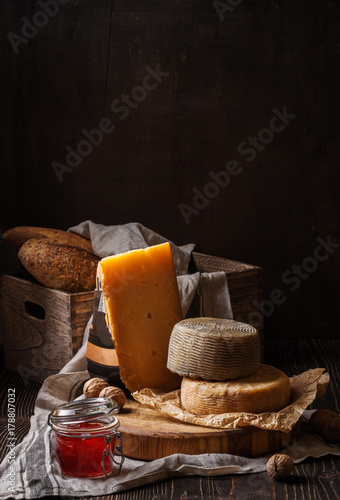 Dark still life with cheese and bread
