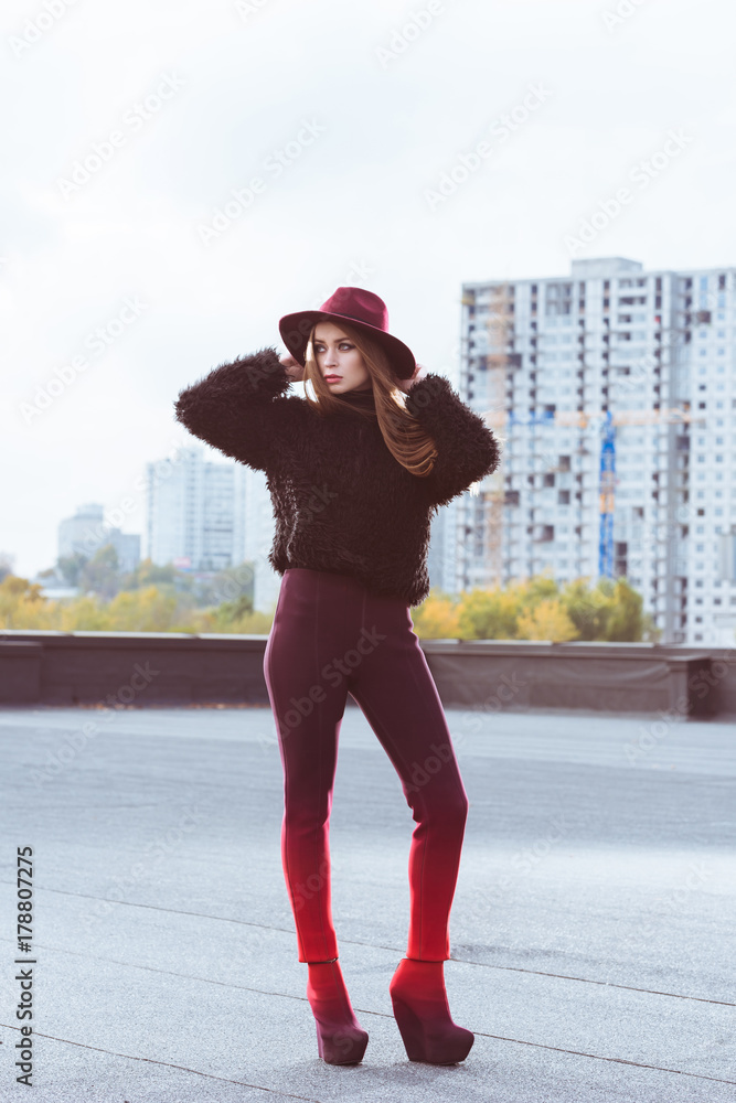 girl in burgundy hat and autumn outfit