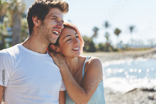 Happy woman leaning on her boyfriend looking away © innervisionpro
