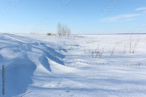 Snow island on the river in winter, Khrenovy Island, Reservoir on the Ob river, Siberia, Russia