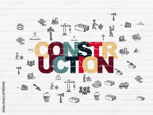 Constructing concept  Painted multicolor text Construction on White Brick wall background with  Hand Drawn Building Icons