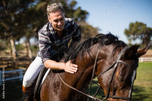 Man riding a horse in the ranch