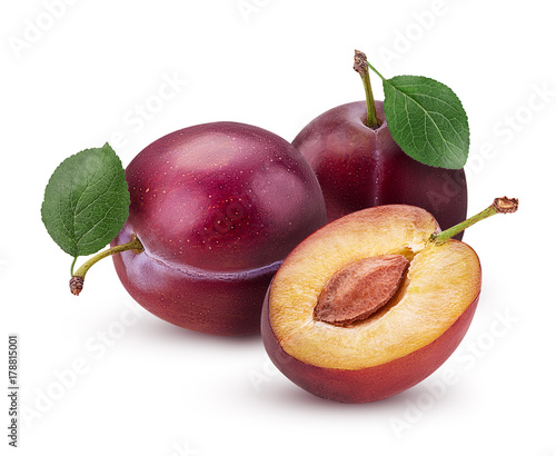 Canvas Print Two Fresh plum with leaf and one cut in half with bone