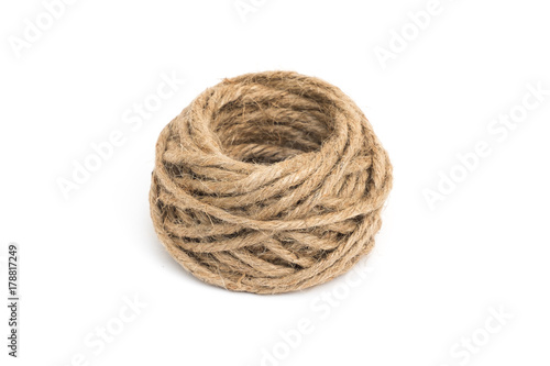 roll of brown rope on white background