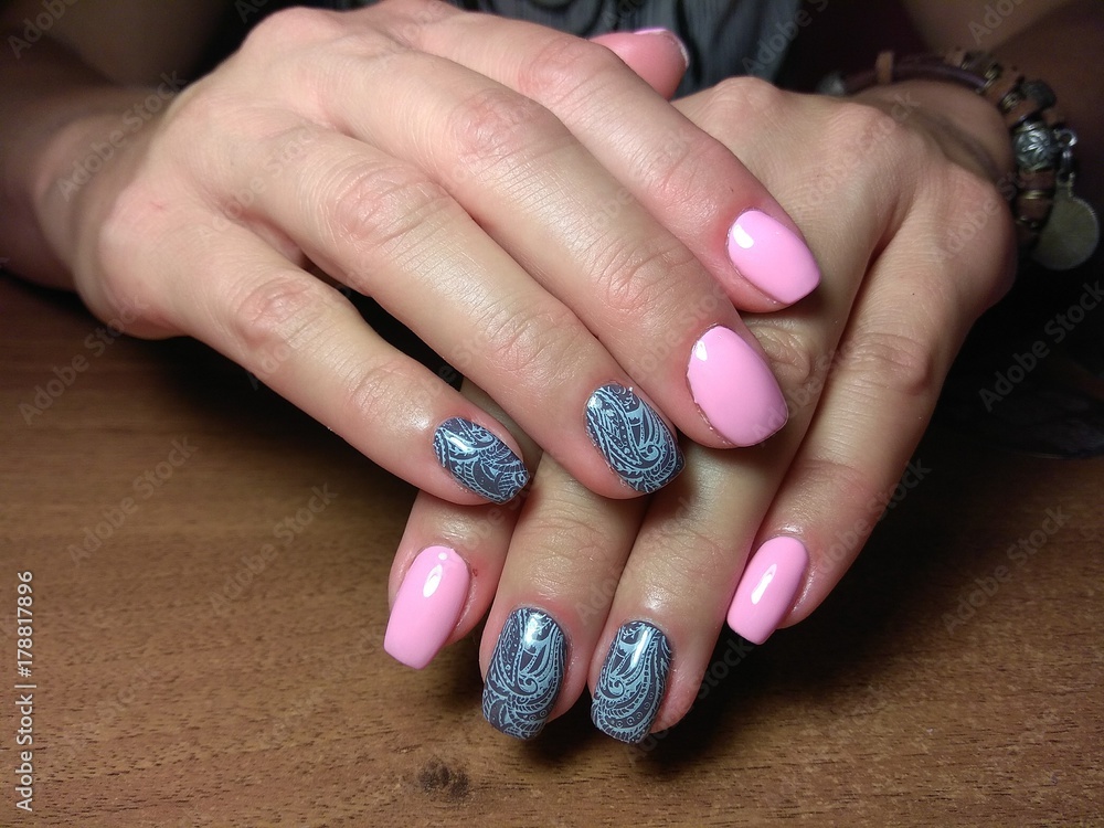 The manicurist excellently made her work a beautiful manicure with a polish gel on her hands and the client is happy The manicurist excellently made her work a beautiful manicure with a polish gel on her hands and the client is happy