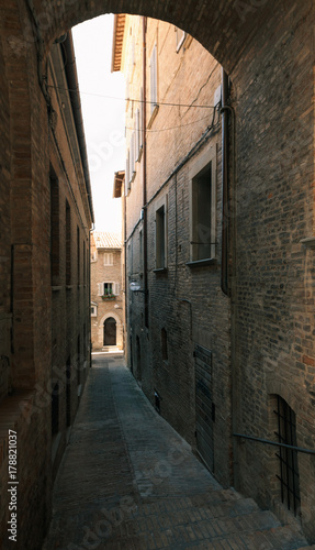 Urbino  Italy - August 9  2017  A small street in the old town of Urbino. sunny day.