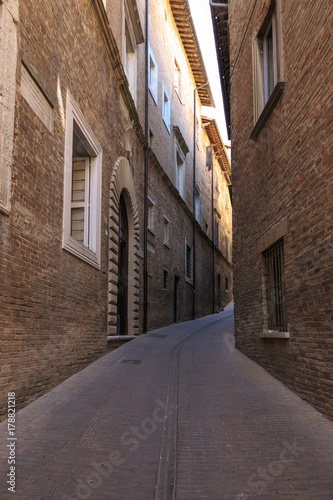 Urbino, Italy - August 9, 2017: A small street in the old town of Urbino. sunny day. © makam1969