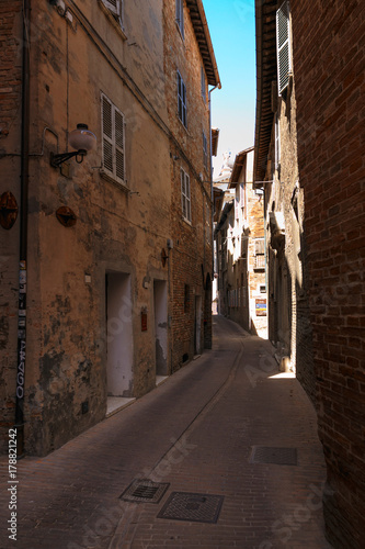 Urbino  Italy - August 9  2017  A small street in the old town of Urbino. sunny day.