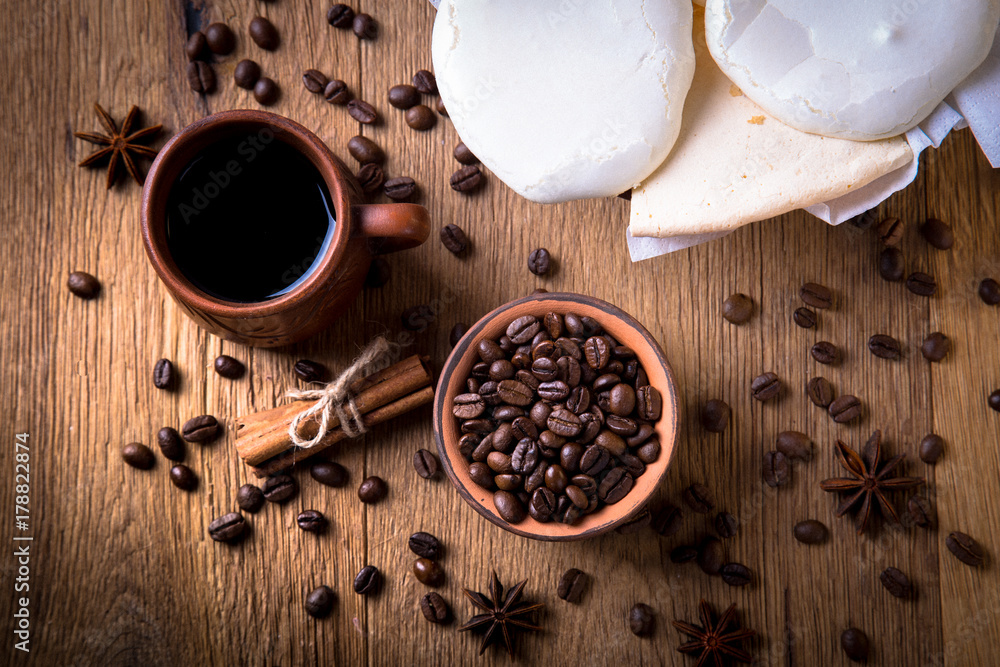 grains of black coffee on the wooden table grains of black coffee on the wooden table