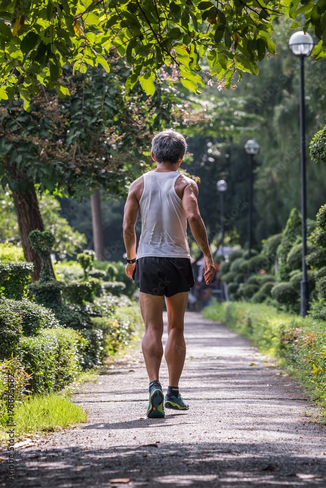 Man jogging run in a outdoor park for exercise