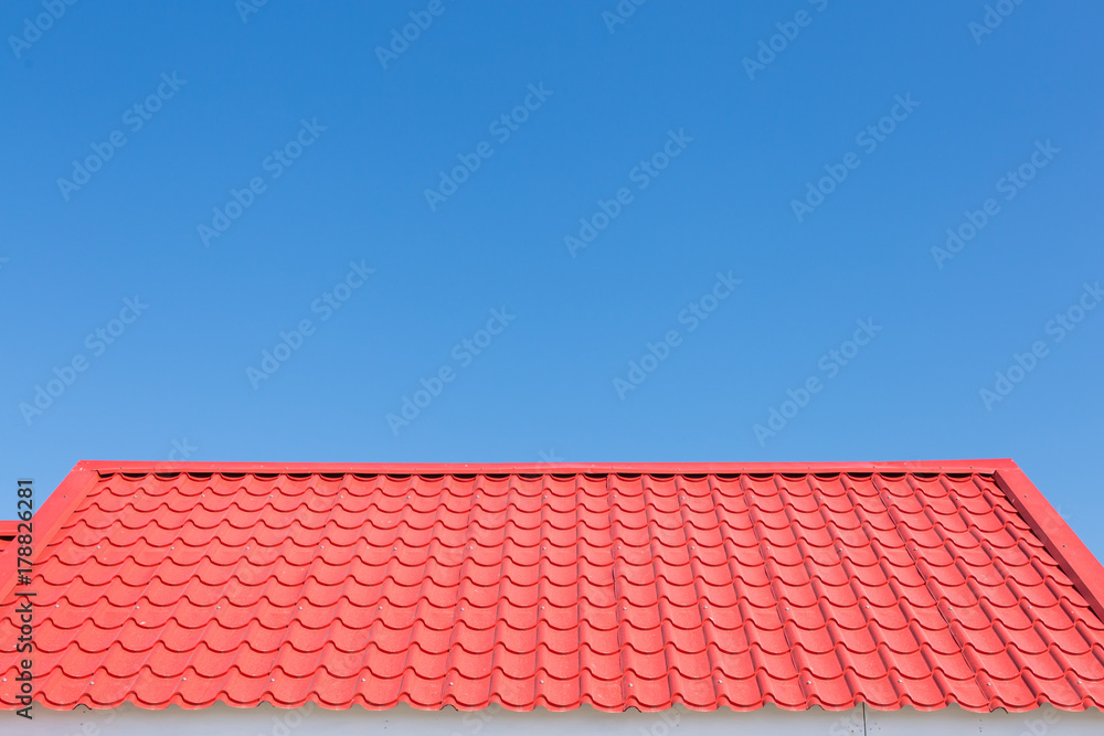 Red roof with blue sky background Red roof with blue sky background