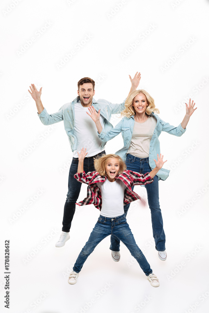 Full length portrait of a happy family with a child Full length portrait of a happy family with a child