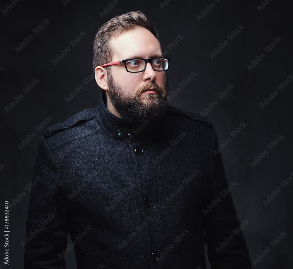 Fototapeta premium Serious plump male in eyeglasses over grey background.