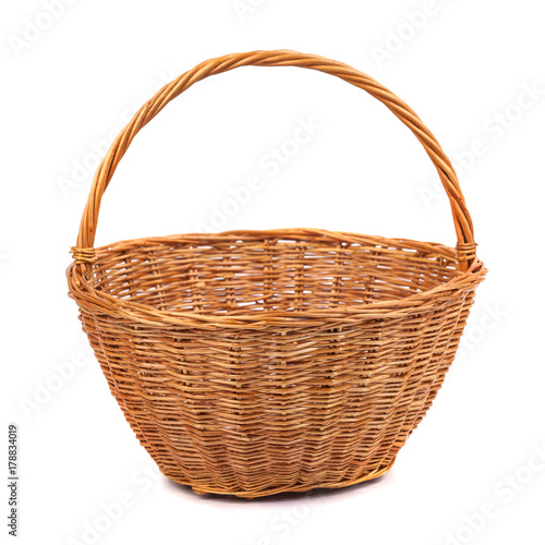 Empty wicker basket for fruits and vegetables, isolated on white.